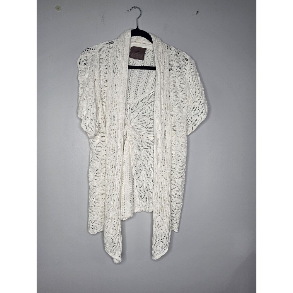 Guinevere Cardigan features a White Open-knit Crochet Pattern with Short Sleeves